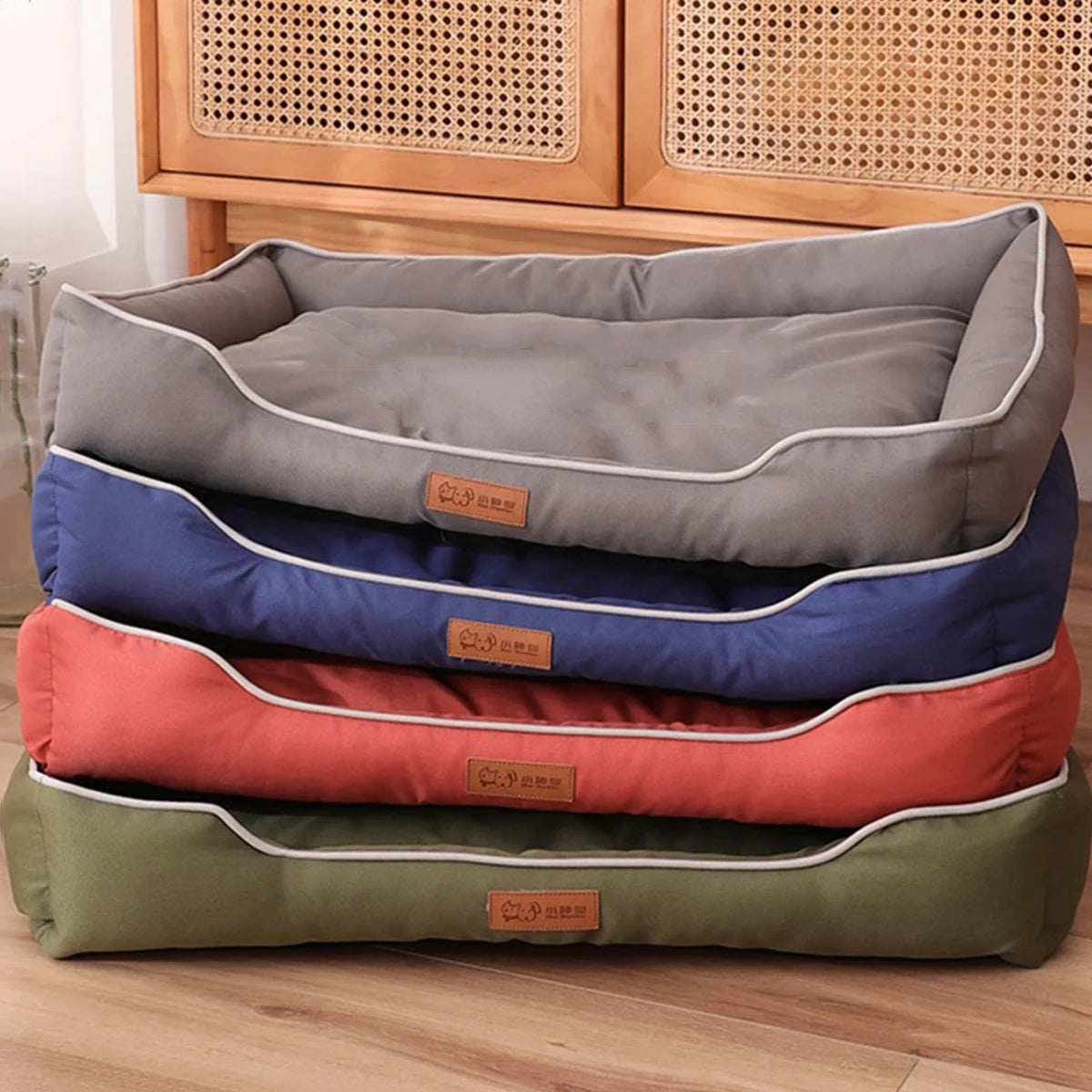 Four Season Square Dog Bed in various colors stacked neatly for pet comfort and style.